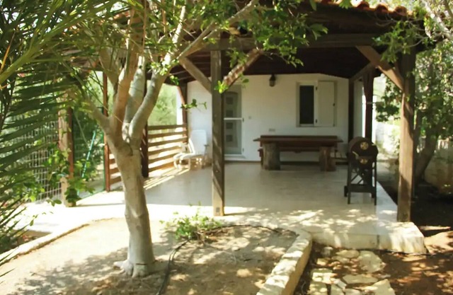 House with garden ON beach
