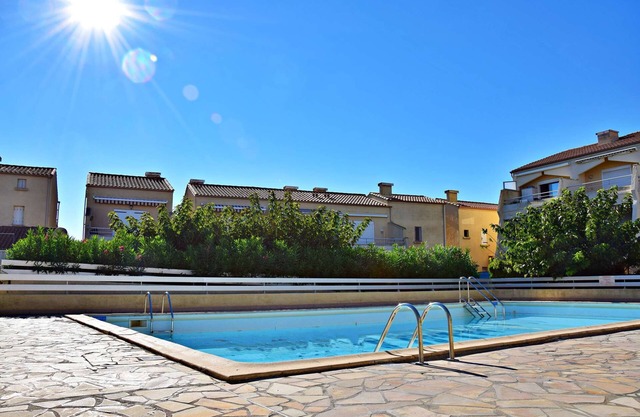In a residence with a pool, close to all amenities