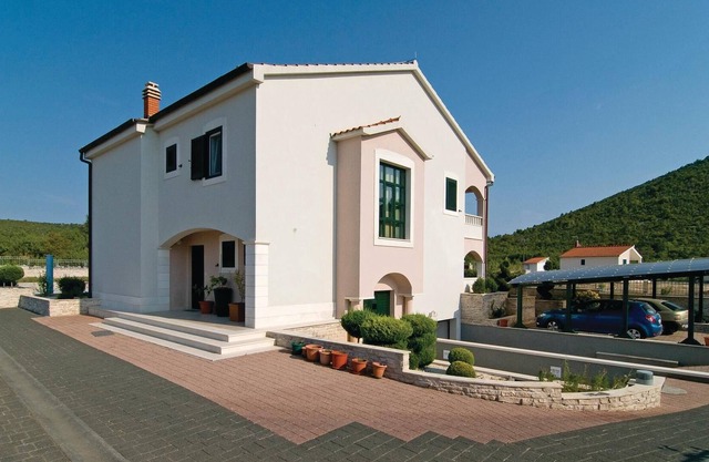 In a small quiet place in a large garden is located this cottage with nicely furnished interiors.