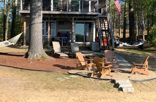 Lake Winnisquam home with beach and private boat dock. 15 minutes to Gunstock.