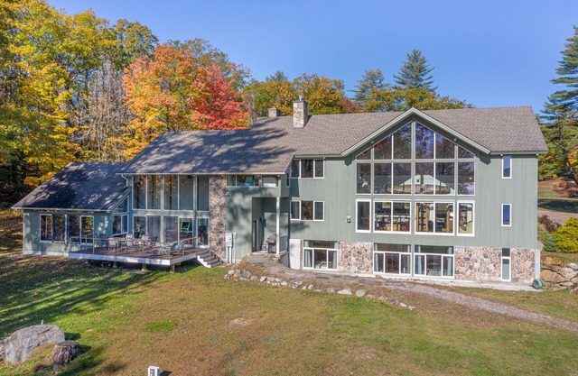 Lakefront home with gym, game room, home theatre, & private beach with boathouse