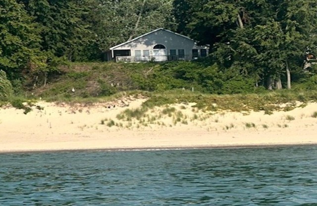 Lakefront two-bedroom cottage with private beach & breathtaking views of Lake MI