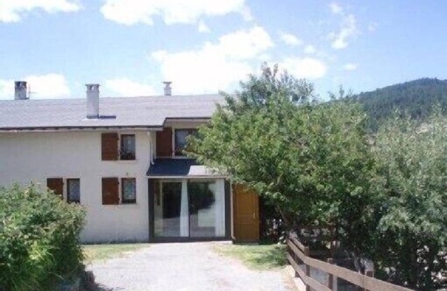 Large self-catered chalet, mature garden, all mod cons, south oriented veranda