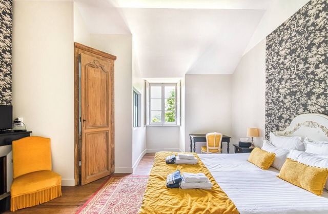 Lavishly decorated double room at Château Le Fresne