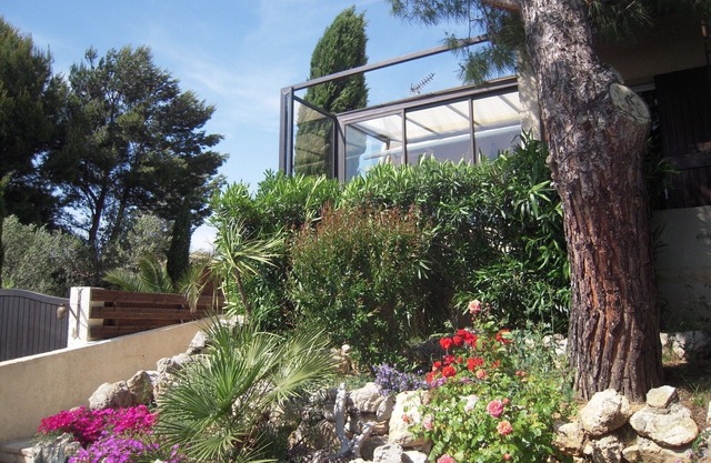 Leucate Beach: house with garden on the cliff, pond and Canigou view