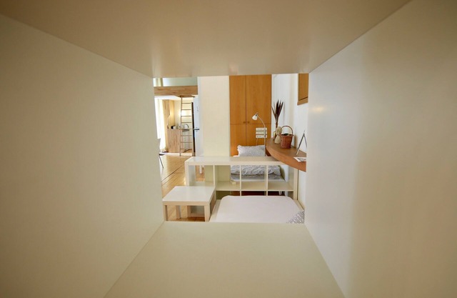 Loft with parquet and designer lights by Ingo Maurer - attractive and stylish