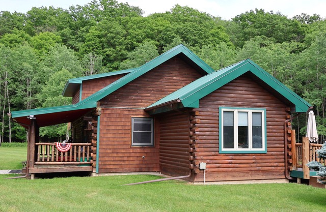 Log Cabin Living in this rustic yet refined home with ample space and privacy!