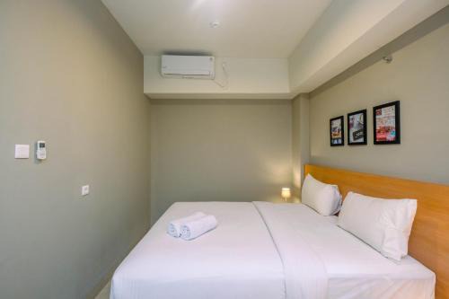 Luxury 1BR Apartment with Golf View at Mustika Golf Residence By Travelio