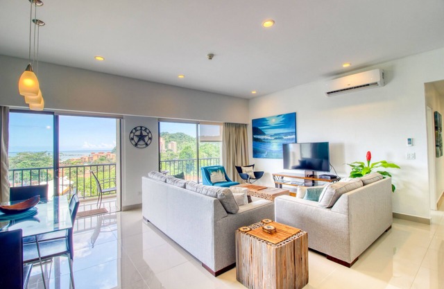 Luxury condo with balcony, ocean & jungle views - open layout