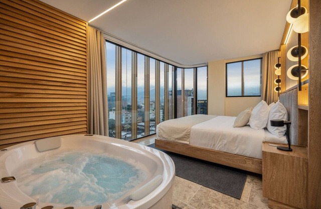 Luxury Suite with AC, Private Hot Tub & City View