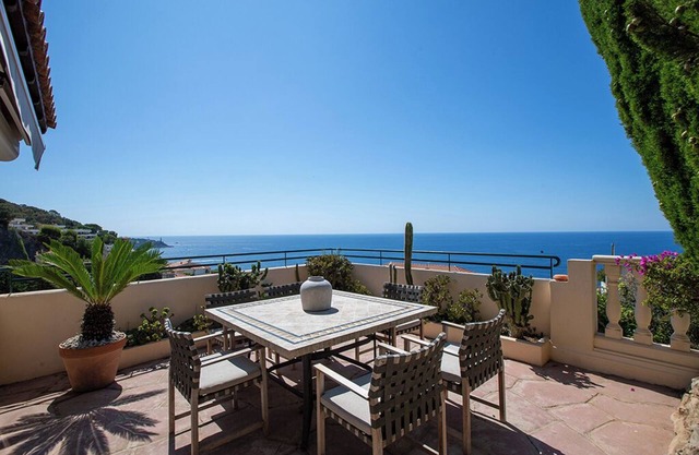Luxury villa apartment with panoramic sea views and small private garden