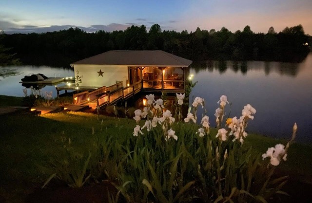 Main house & guest cottage on over 400 feet of waterfront on the public side