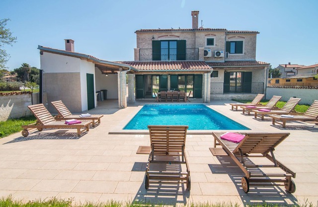 Minimalistically decorated villa Pomer with private pool and fenced yard