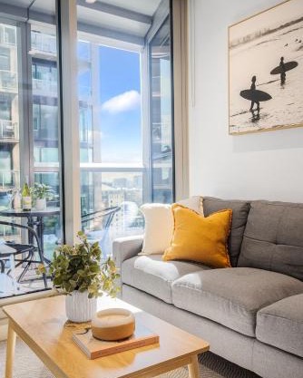 Modern 2BR Getaway, Prime CBD, Balcony, Pool, Gym