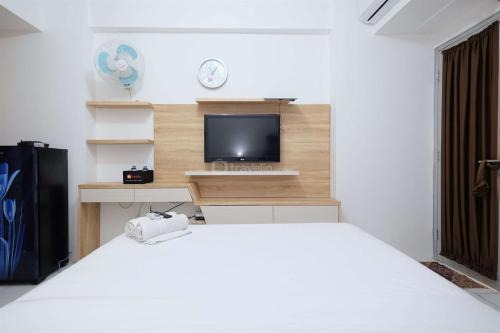 Modern and Homey Studio at Gunung Putri Apartment By Travelio
