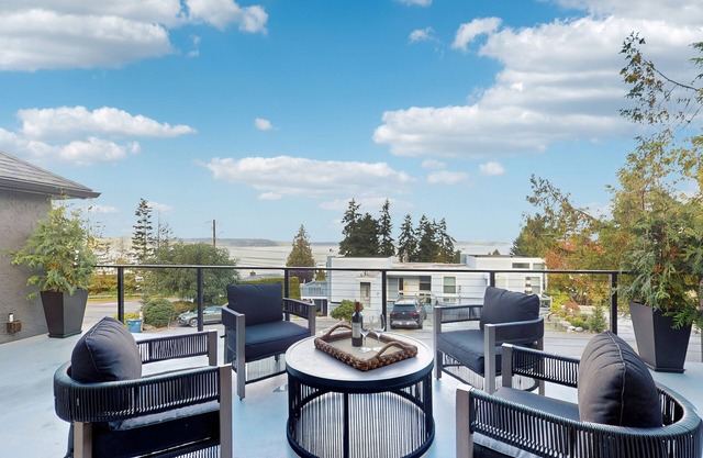 Modern retreat with panoramic ocean views, chef’s kitchen, and gas fireplace