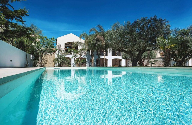 My Rental Homes - Casa Tika with shared pool surrounded by a wonderful garden