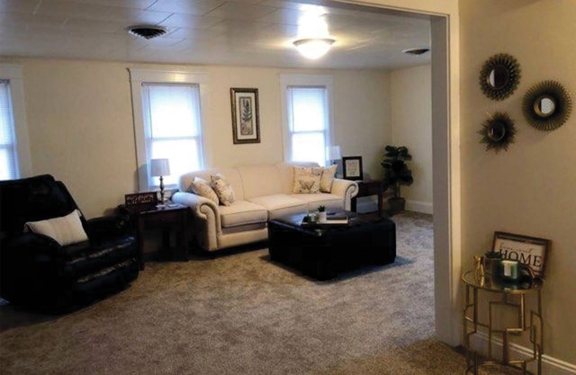 Newly renovated, and decorated upstairs apartment with attached garage.
