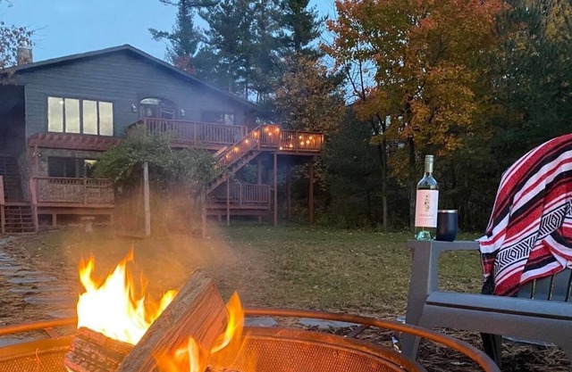 Newly renovated Lake Side Leisure with boat dock, fire pit, and updated decor in a modern lake home