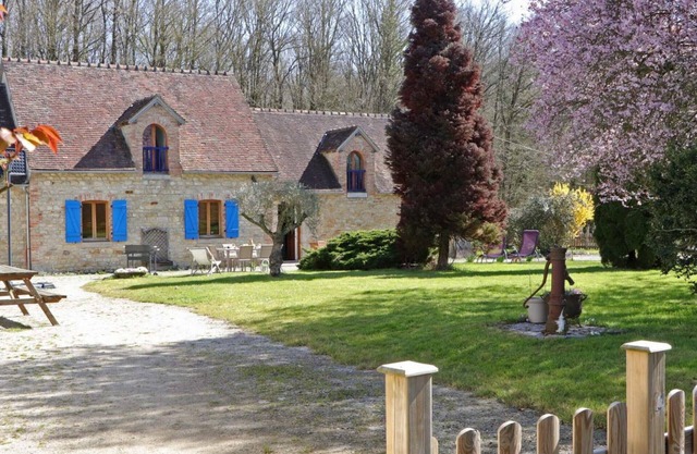 Old house with enclosed garden in the forest