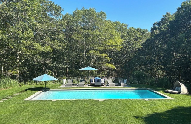 Outdoor living.Ideal location in East Hampton with resort inspired backyard!