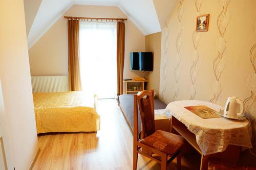 Pokoje Gościnne "Adam"