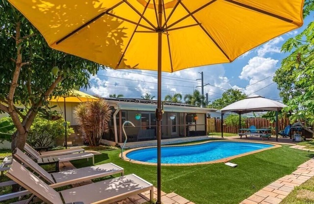 Pool House Near Beach w/ Sunroom and Lounge Areas