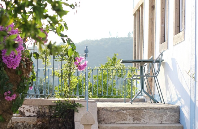 Relax and unwind in this stylish Portuguese Farmhouse.