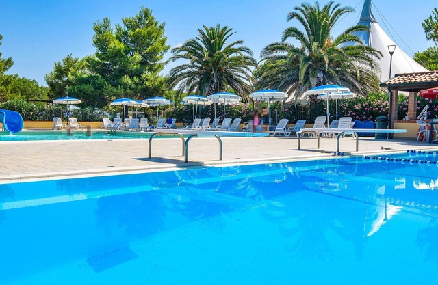 Relax in this cozy vacation home with a shared pool.