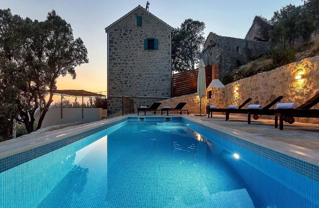 Romantic stone villa with heated pool and sea views in a quiet location