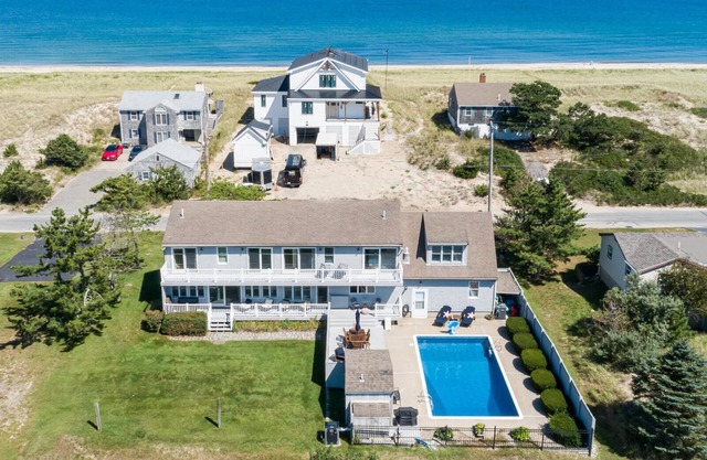 Sagamore Beach just across the street from this gorgeous home with private heated pool
