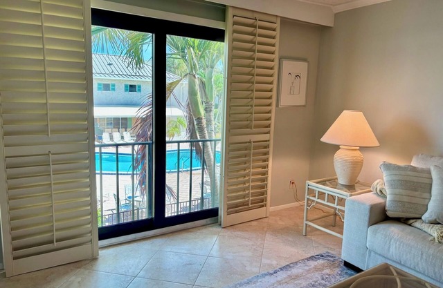 Sandy Toes & Sunrise Views: Beachside Condo
