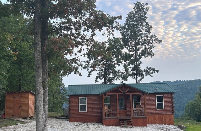 Secluded off grid cabin located on mountain ridge looking down beautiful valley