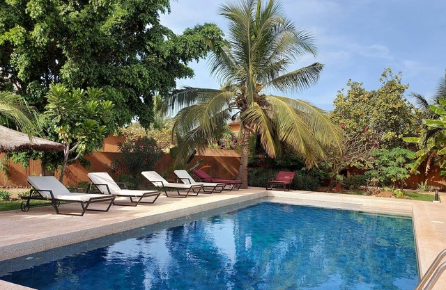 Secure villa with swimming pool and exotic garden
