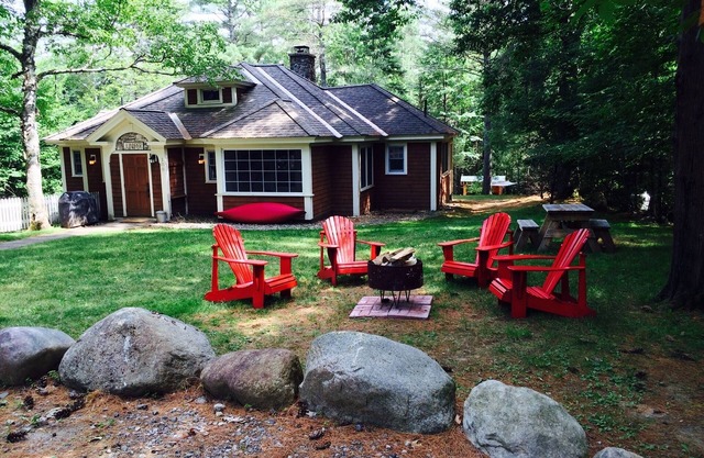 Short walk to village.with private wooded setting. EV Charger in parking area.