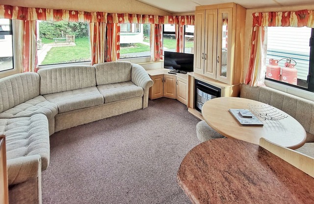 Spacious 12ft-wide caravan with one double and one twin.
