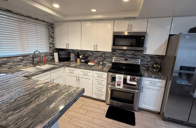 Spacious & Accessible 2-bedroom Condo with Pool & Private Garage, BEST LOCATION!