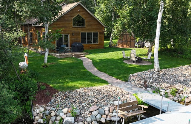 Spacious Summer Escape: Private Backyard, Dock & Fire Pit, Channel Waterfront