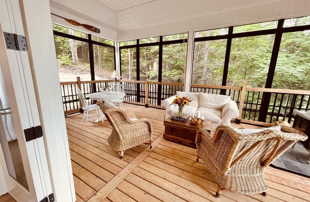Spectacular new 4 season cottage on pristine Kennisis Lake! Sauna and hot tub!