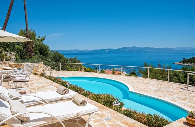 Splendid stone villa hovering above bay and sea views,with private pool