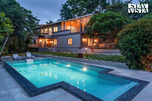 StayVista at Amber & Mist - Pool and Lawn