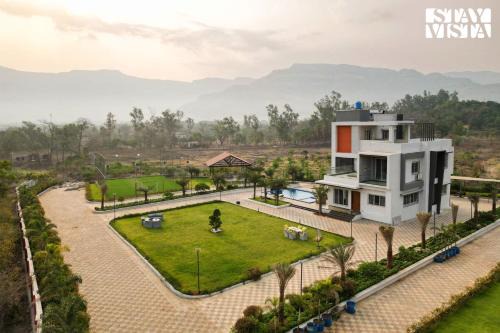 StayVista's Oasis Of Solace - Mountain-View Villa with Pool Deck, Kids Zone, Turf & Gazebo