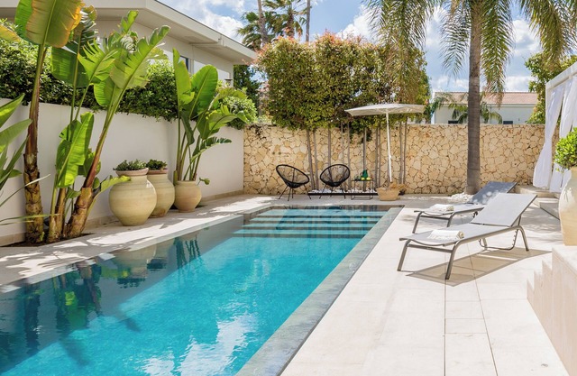 Stylish holiday home with saltwater pool, a stone's throw from the sandy beach.