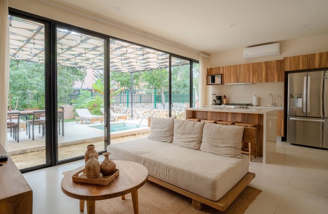 Sun-soaked & modern beach getaway with pool, generous patio, gym, & great views