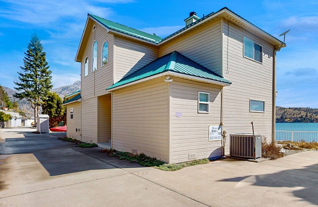 Sunny, lakefront home with huge patio, floating dock & 2 buoys