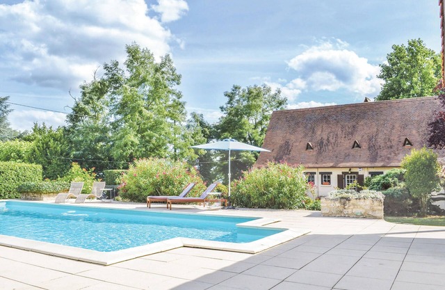 This inviting vacation home with private pool is nestled in a beautiful enclosed garden.