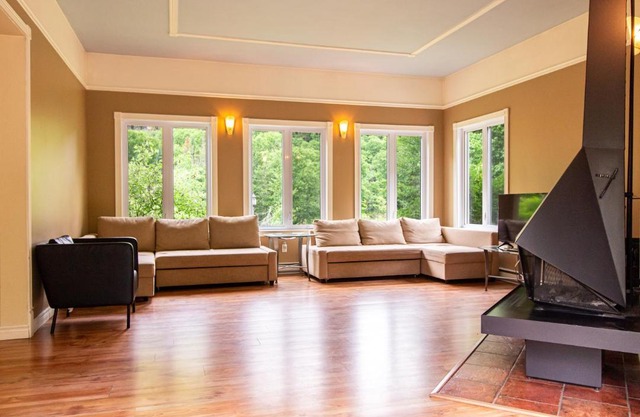 Tranquil Riverfront Chalet with Hot Tub