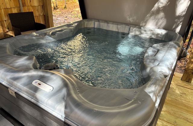 Two bedroom cabin with hot tub and fireplace.