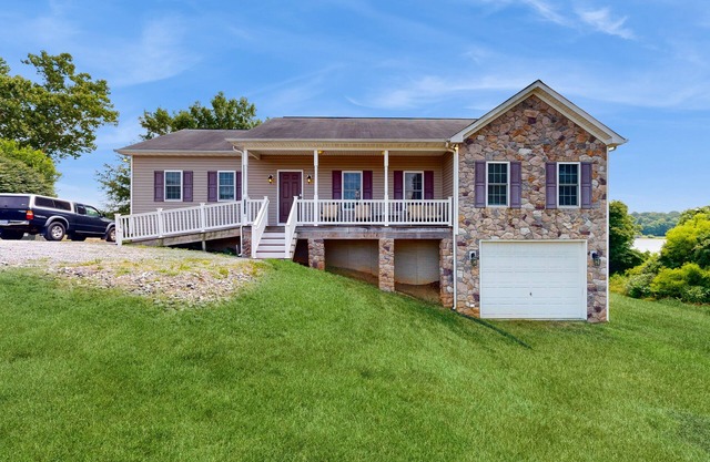 Two-story, lakefront getaway with dock, beach, grill, 2 kayaks, 2 canoes, AC