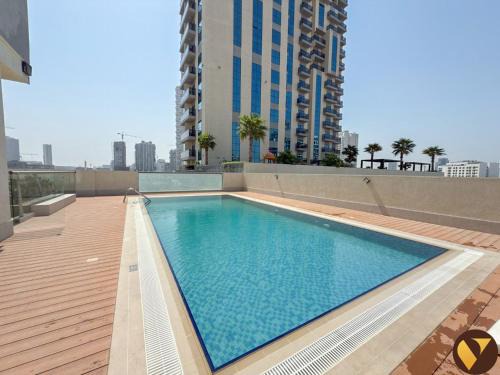 Vogue Elegant JVC Apartment near Circle Mall with large balcony Pool and Gym access